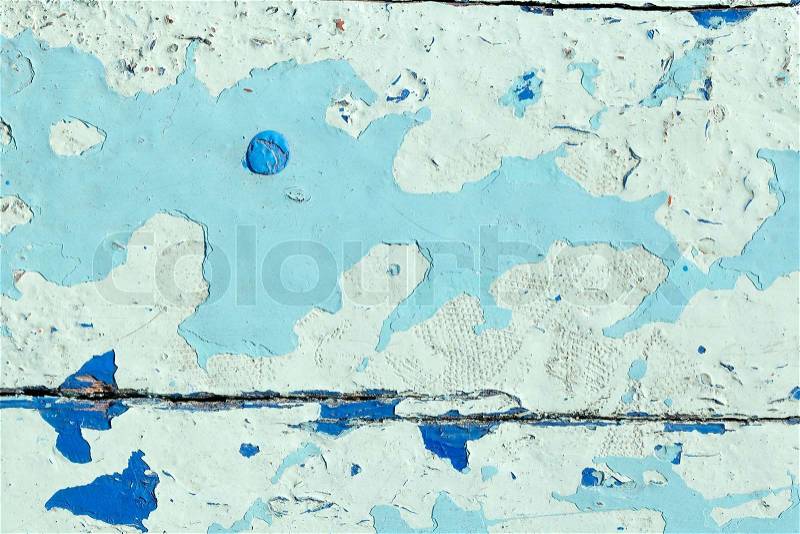 Close up shot of old light blue paint texture peeling off wood plank background, stock photo