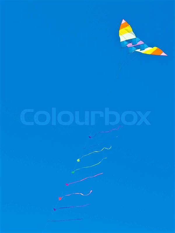 Various Colorful Kites Flying in a Bright Blue Sky at the Long Beach Kite Festival, stock photo