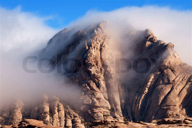 Clouds in desert mountains Bektau-Ata in Kazakhstan, stock photo