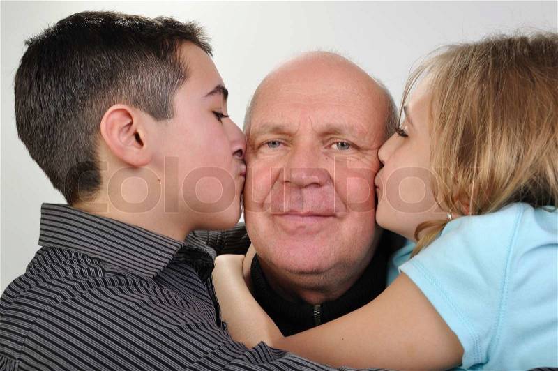 Happy family portrait of elderly father with his daughter and son, stock photo