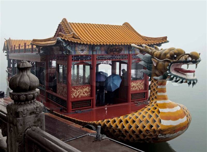 Rainy scenery including a dragon-styled boat near Beijing in China, stock photo