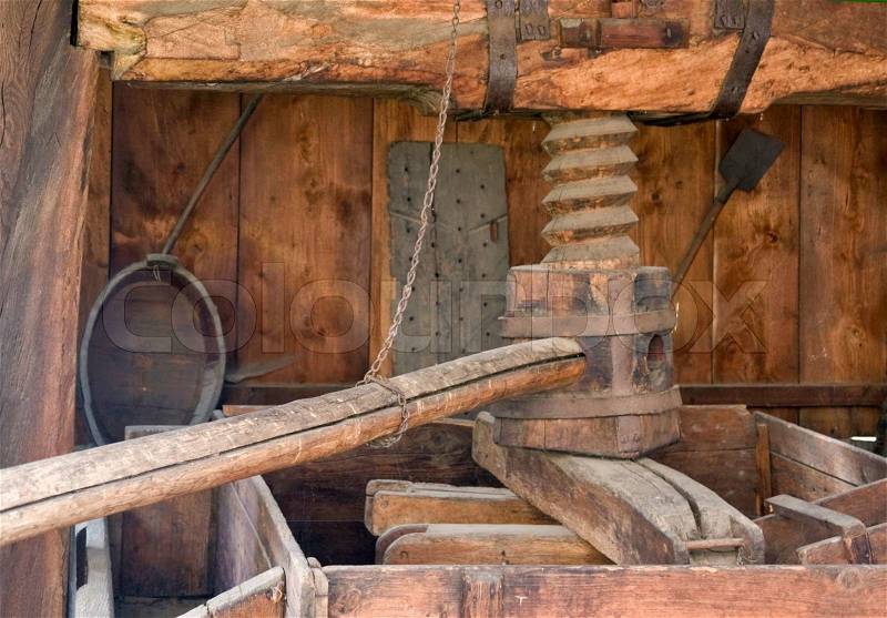 Detail of a historic wooden wine press, seen in Alsace France, stock photo
