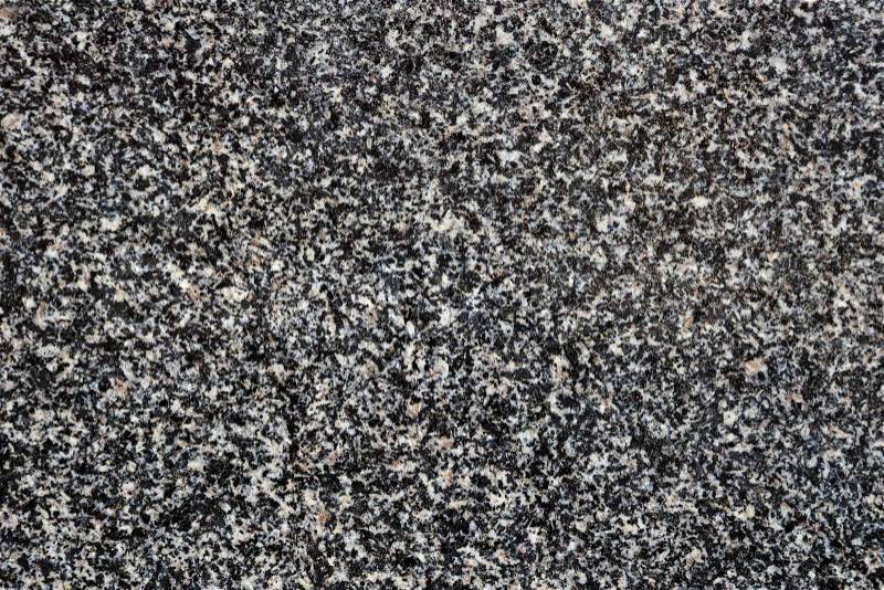Polished gray and black grain granite as background, stock photo