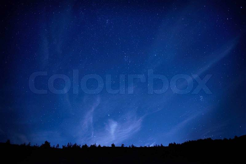 Blue dark night sky with many stars. Space background, stock photo