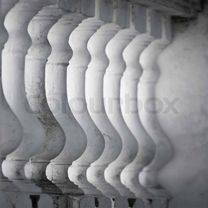 Row of white balusters. Abstract classical architecture fragment, stock photo
