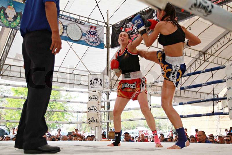 AYUTTHAYA, THAILAND- MARCH 17 : Thai boxing match at Muay Thai Fight Fastival on March 17, 2013, Moless France RED vs Tobe Sweden BLUE,Tobe Sweden BLUE is winner in Ayutthaya, Thailand, stock photo