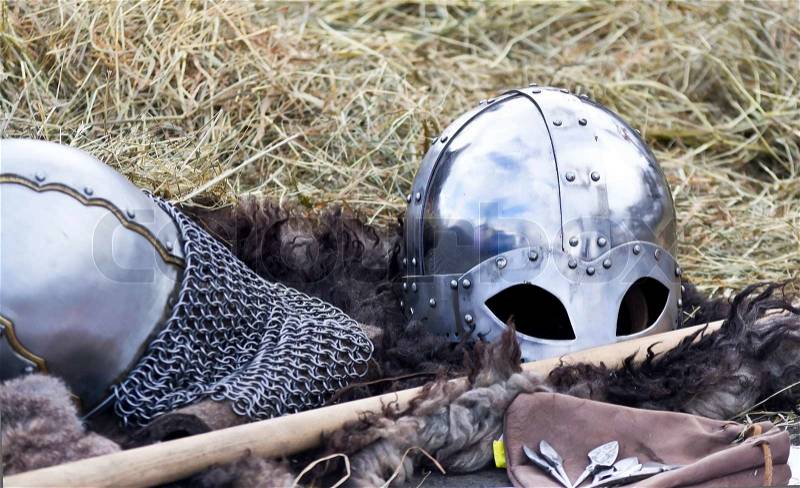 Knight\'s helmet on a background of hay, stock photo