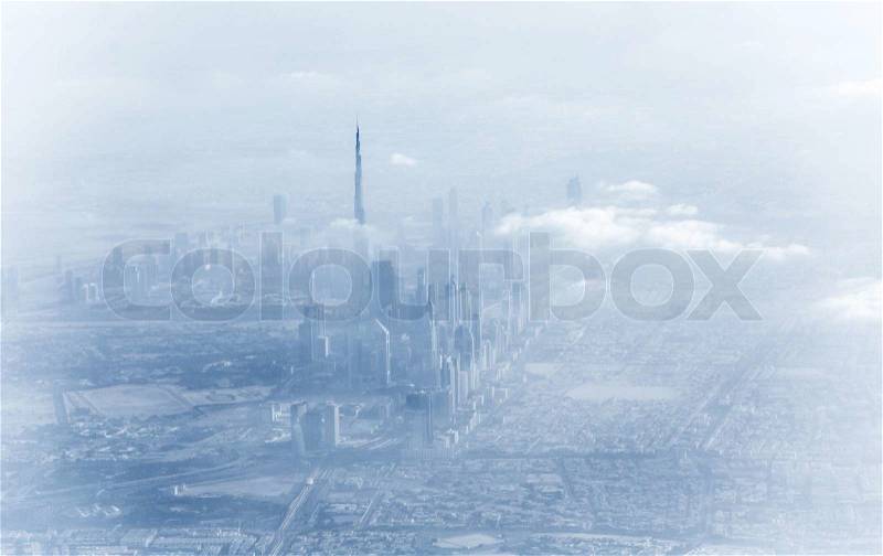 Dubai downtown in fog, beautiful misty cityscape, bad weather on luxury resort, UAE, vacation and travel concept, stock photo