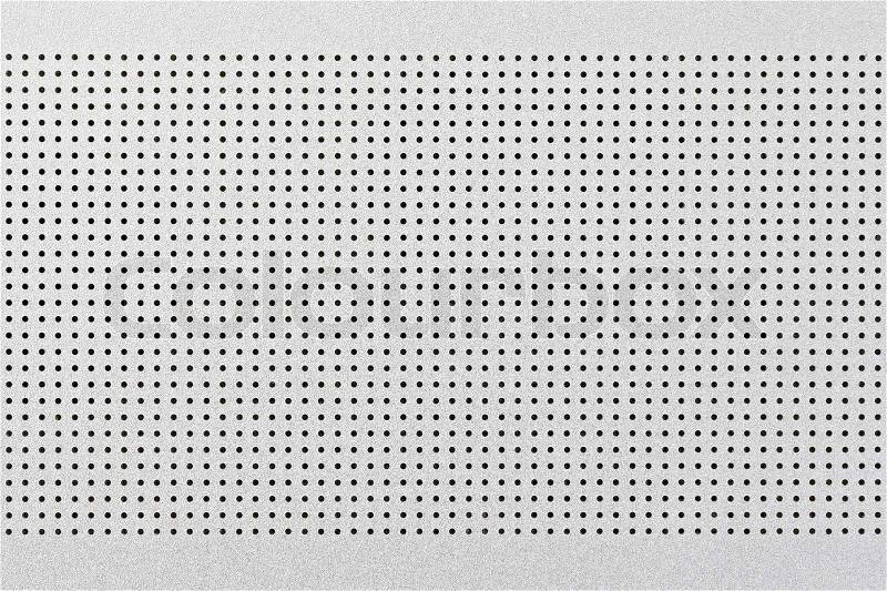 Close up shot of aluminium holed or perforated grid texture background. dot pattern, stock photo