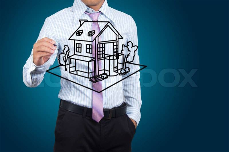 Businessman drawing house in a whiteboard, stock photo