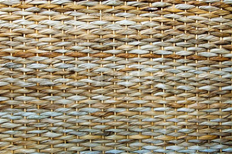 Texture of woven reed basket of beige color, stock photo