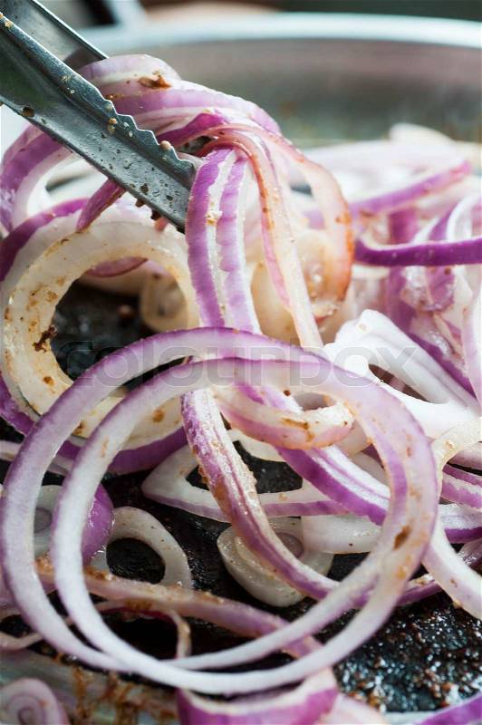 Fried red onion in korean pan, stock photo