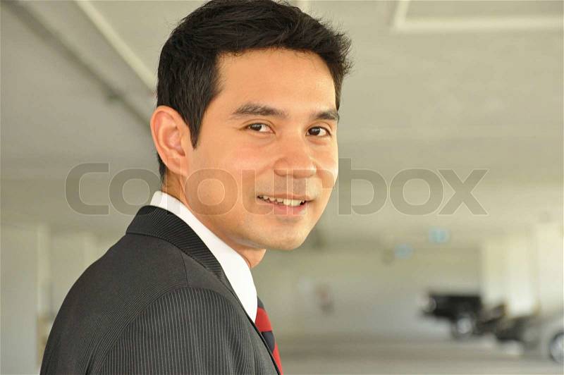 Businessman looking back, stock photo