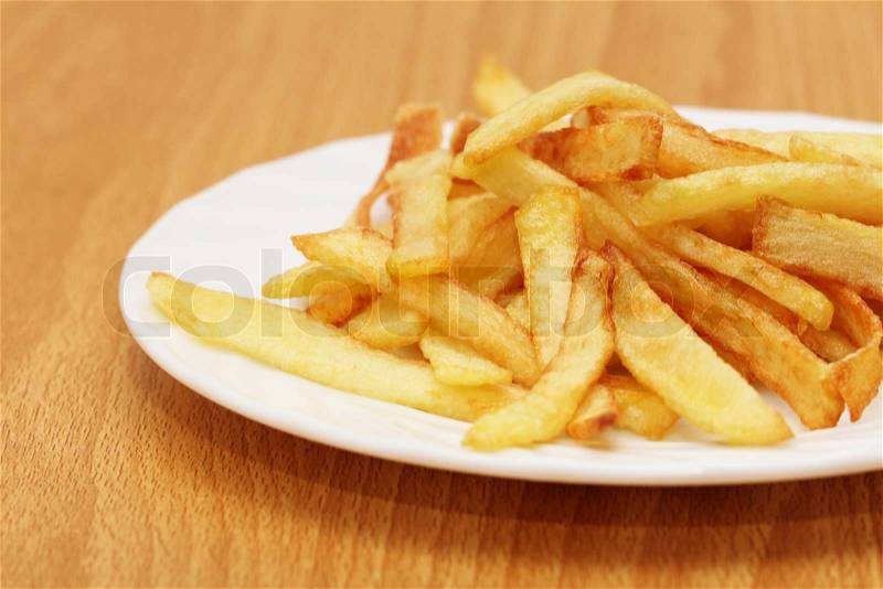 Fried potato slices, potato chips, stock photo