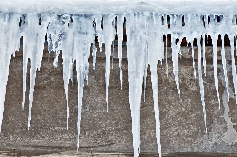 The big white icicles during cold winter, stock photo