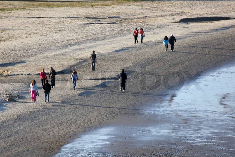 People walking on the beach in Algeciras, Spain, stock photo