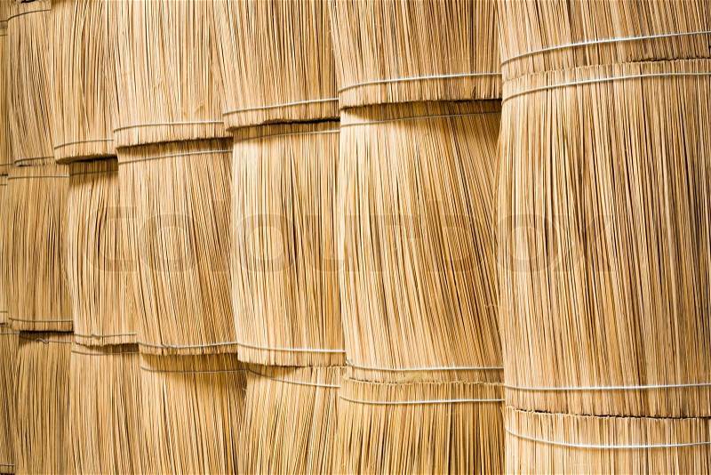 Stacks of sticks bundle for making incense sticks in warehouse, stock photo