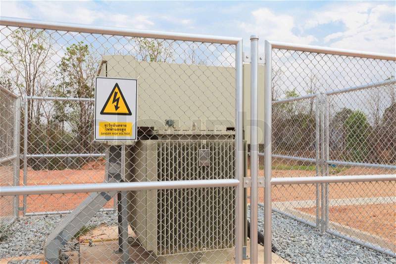 Danger High Voltage sign on a fence, stock photo