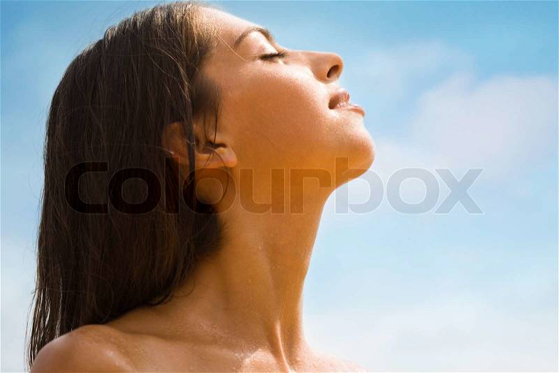 Photo of profile of beautiful woman enjoying a sun , stock photo