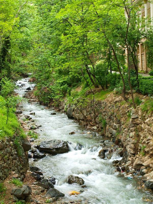 Forest stream running over rocks in Tehran, Iran, stock photo