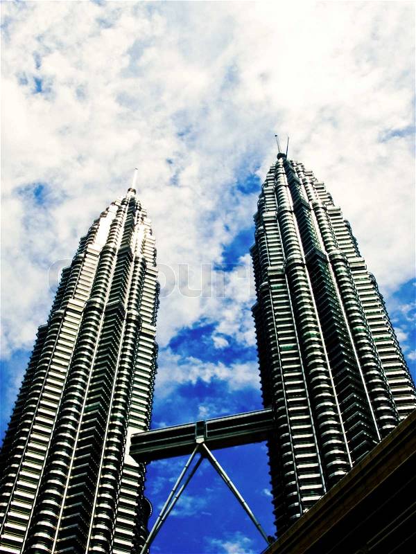 KUALA LUMPUR - MARCH 23: Petronas Twin Towers on March 23, 2011 in Kuala Lumpur. Petronas Twin Towers were the tallest buildings in the world from 1998 to 2004, but remain the tallest twin buildings, stock photo