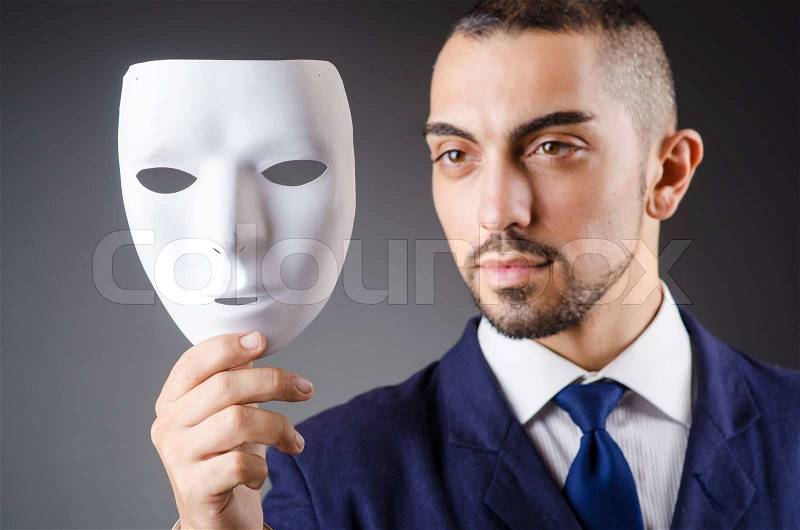 Man with mask in the dark, stock photo