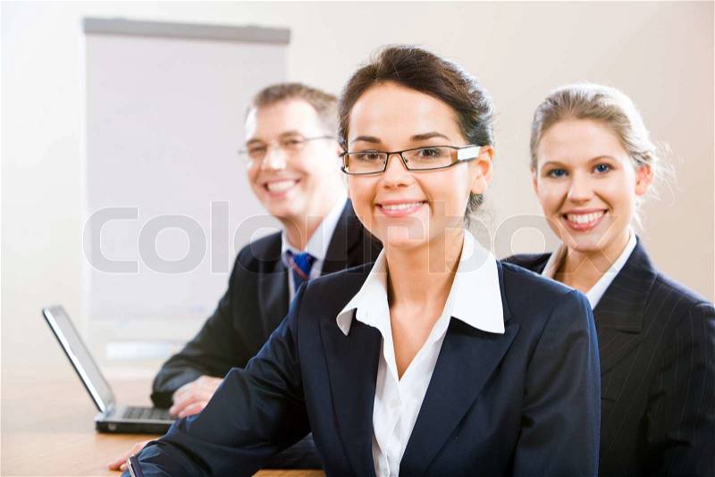 Image of female leader with her business team, stock photo