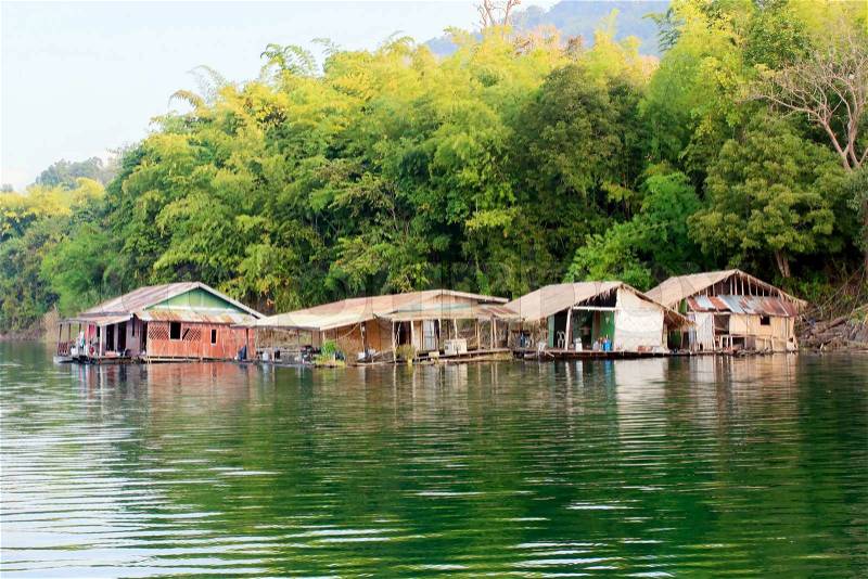 Floating house on the Vajiralongkorn Dam at Kanjanburi, Thailand , stock photo