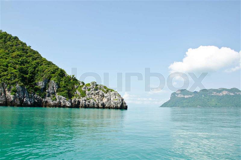 Bright green island in the middle of the sea in Thailand, stock photo