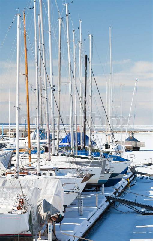 Luxury yachts on the coast in winter season Tallinn marina, stock photo
