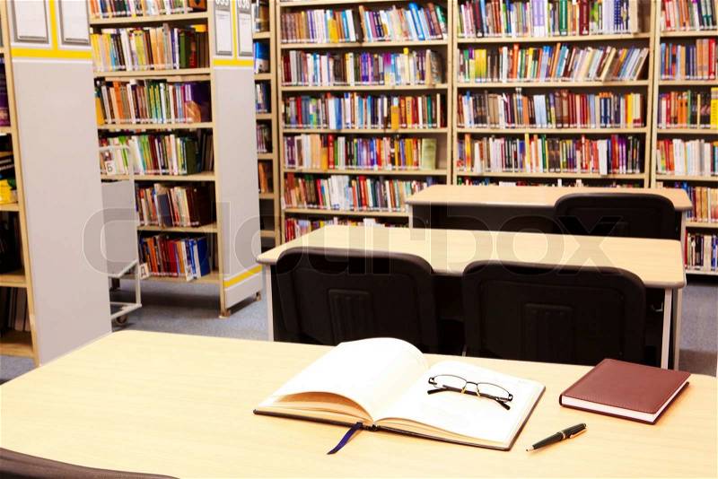 Photo of workplace in modern library of college or other educational institution, stock photo