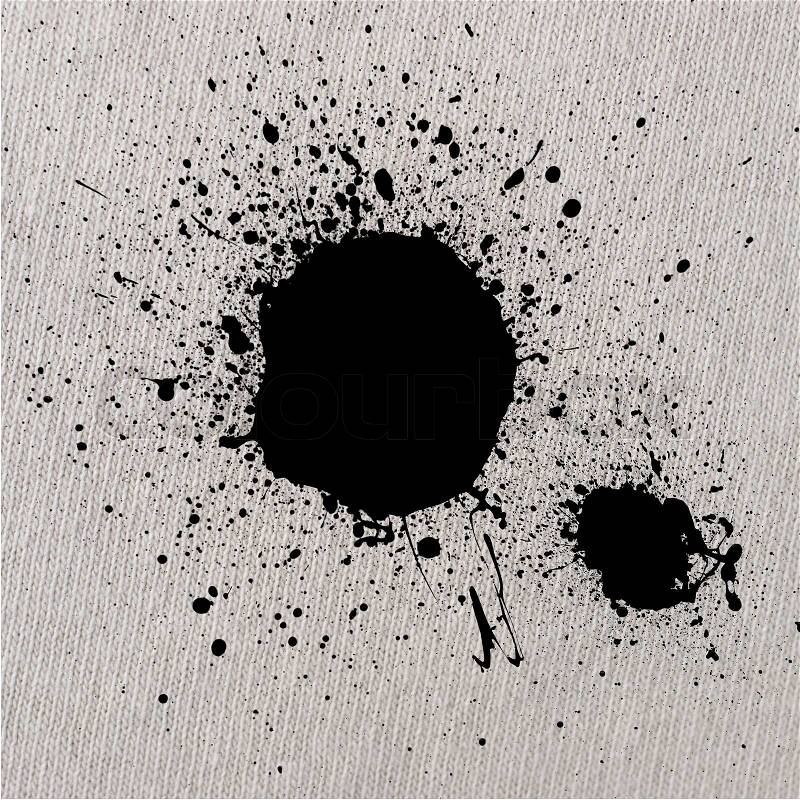 Ink drop on white t-shirt background, stock photo