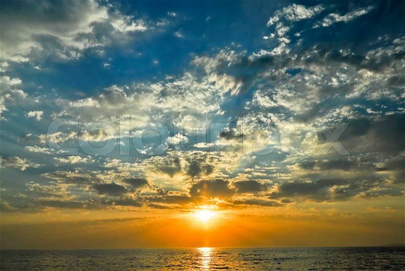 A beautiful late afternoon sky over the sea, stock photo