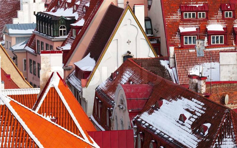 Old town of Tallinn background. Houses with red roofs, stock photo