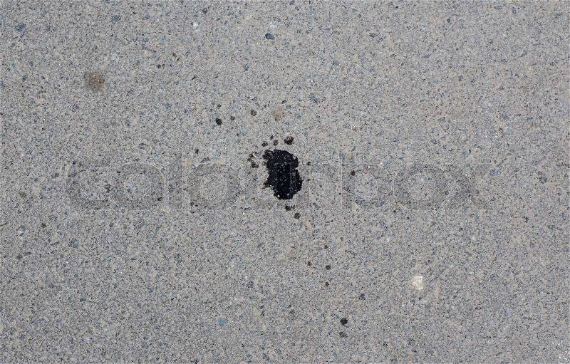 Asphalt with engine oil stains background, stock photo