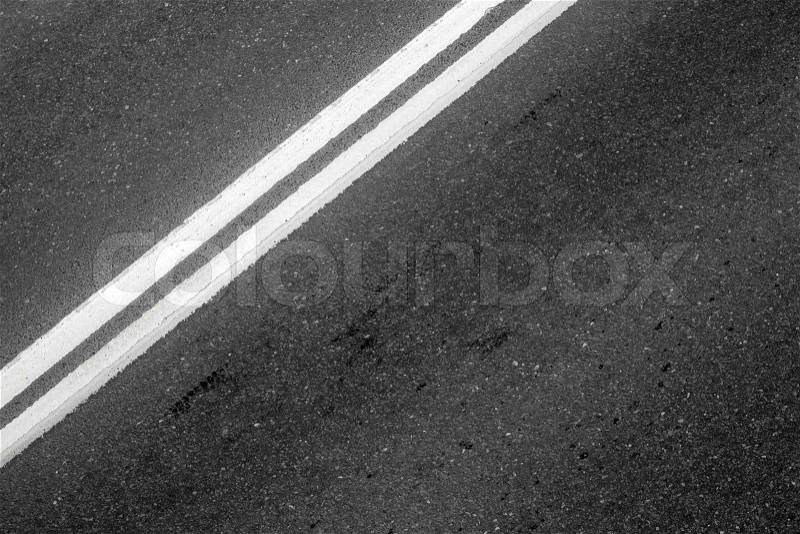 Asphalt road with white double solid line. Transportation background texture, stock photo