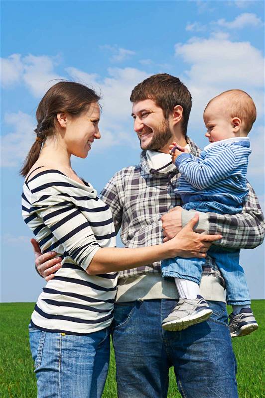 Mother and father with little son, stock photo