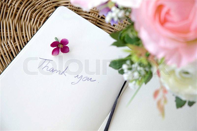 Blossom put beside handwriting words thank you, stock photo