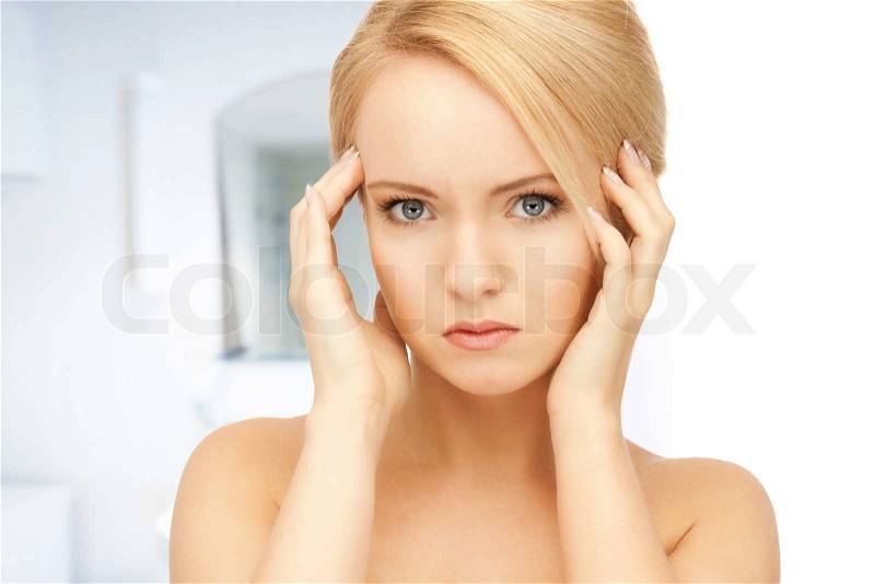 Bright picture of unhappy woman in bathroom, stock photo