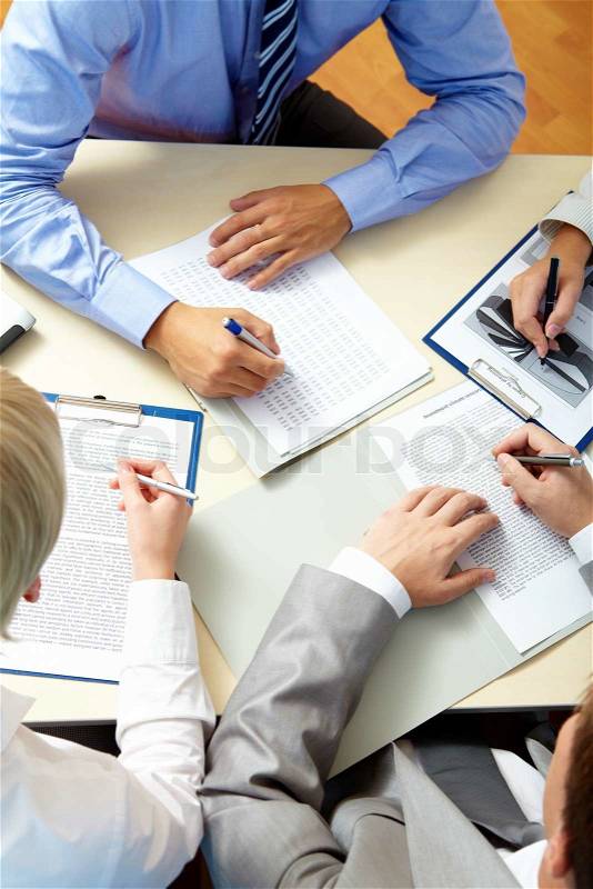 Image of business people hands working with papers at meeting, stock photo