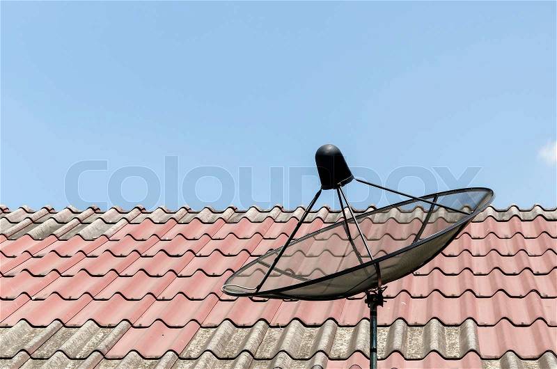 Satellite disc on roof, stock photo
