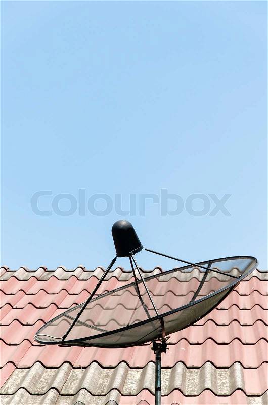 Satellite disc on roof, stock photo