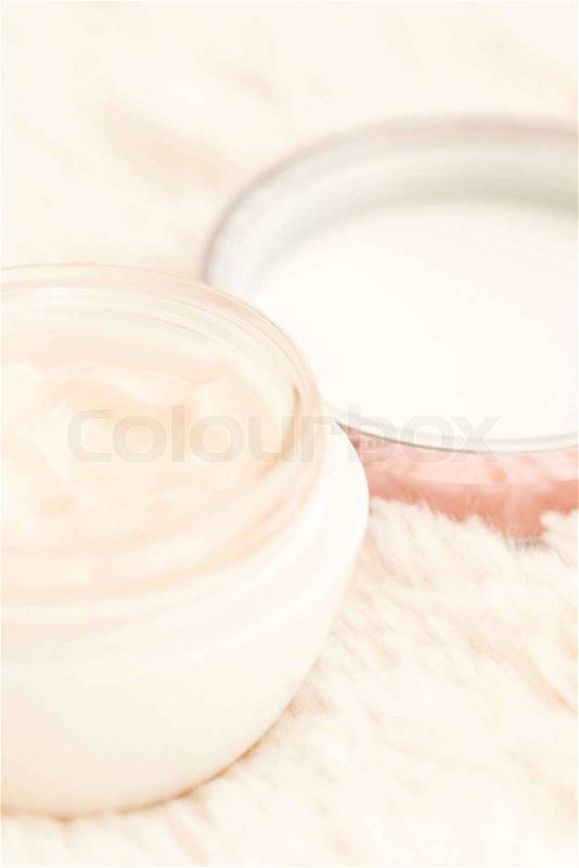 Cosmetic cream in an open jar with shallow depth of field, stock photo