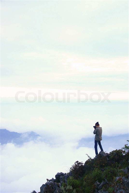 Man on the top of mountain, stock photo