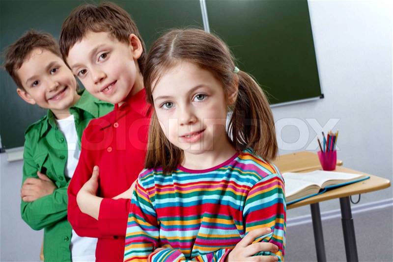 Image of group classmates with leader in front, stock photo