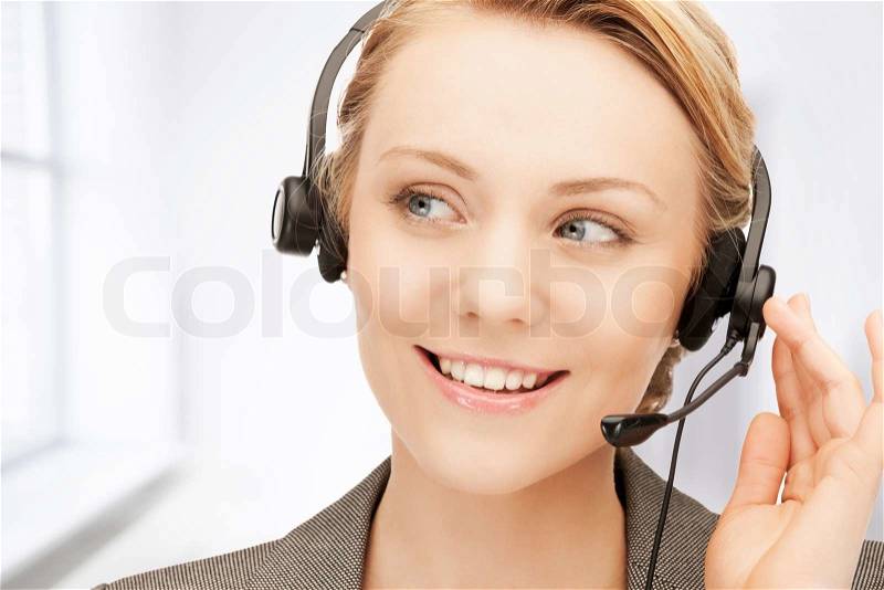 Bright picture of friendly female helpline operator, stock photo