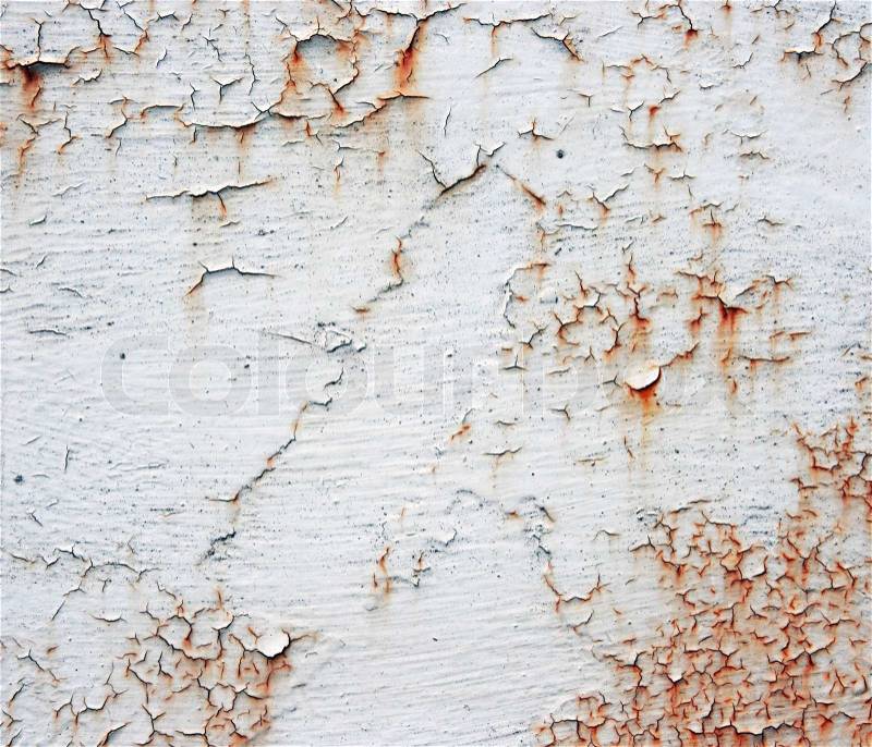 A rusty old metal plate with cracked white gloss paint. Old rusty white metallic background, stock photo
