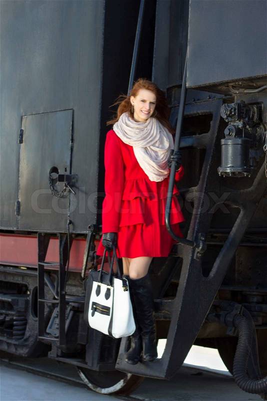 Beautiful woman in red coat and vintage train | Stock Photo ...