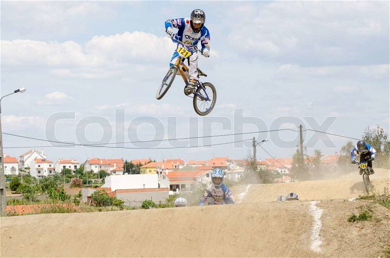 CASTELO BRANCO, PORTUGAL - MAY 5: Andre Duarte big jump at the 3rd stage of the Luso-Spanish BMX race Trophy the on may 5, 2013 in Castelo Branco, Portugal, stock photo