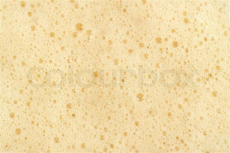 A close-up of foam on top of carbonated drink, stock photo
